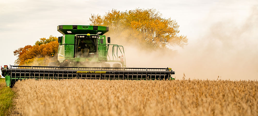 Combine harvesting crops